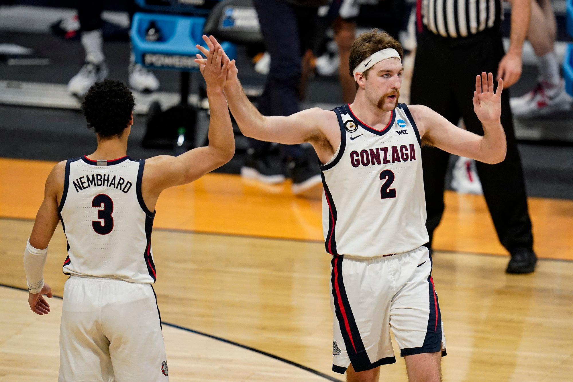 Gonzaga forward Drew Timme (2) celebrates with guard Andrew Nembhard (3) in the second half of a second-round game against Oklahoma in the NCAA men's college basketball tournament at Hinkle Fieldhouse in Indianapolis, Monday, March 22, 2021. (AP Photo/Michael Conroy)