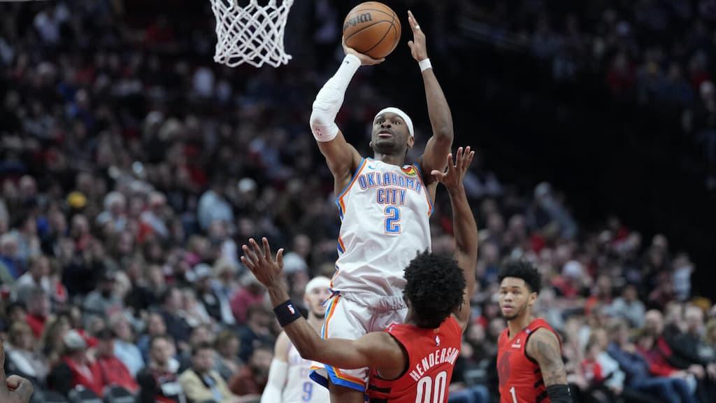 Shai Gilgeous-Alexander of the Oklahoma City Thunder goes for a basket during an NBA game