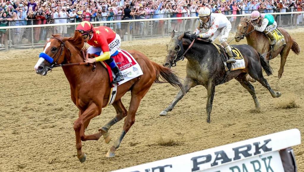Triple Crown Horse Racing Betting Guide cover (2018 Triple Crown winner Justify during his Belmont Stakes win)