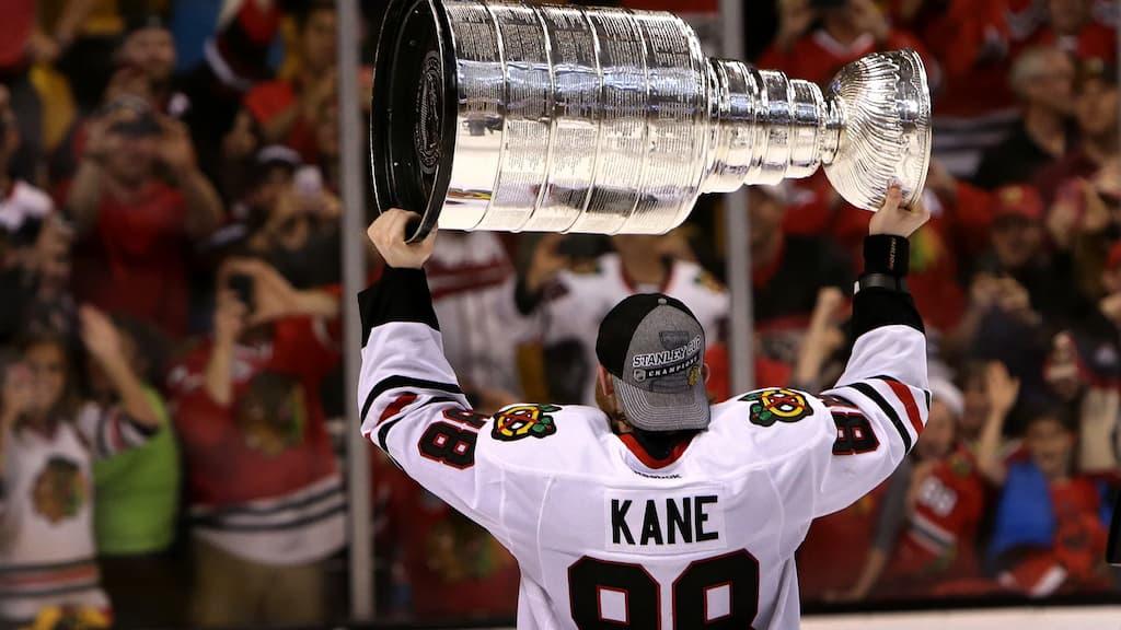 Patrick Kane Chicago Blackhawks reunion article cover (Patrick Kane lifting the Stanley Cup)