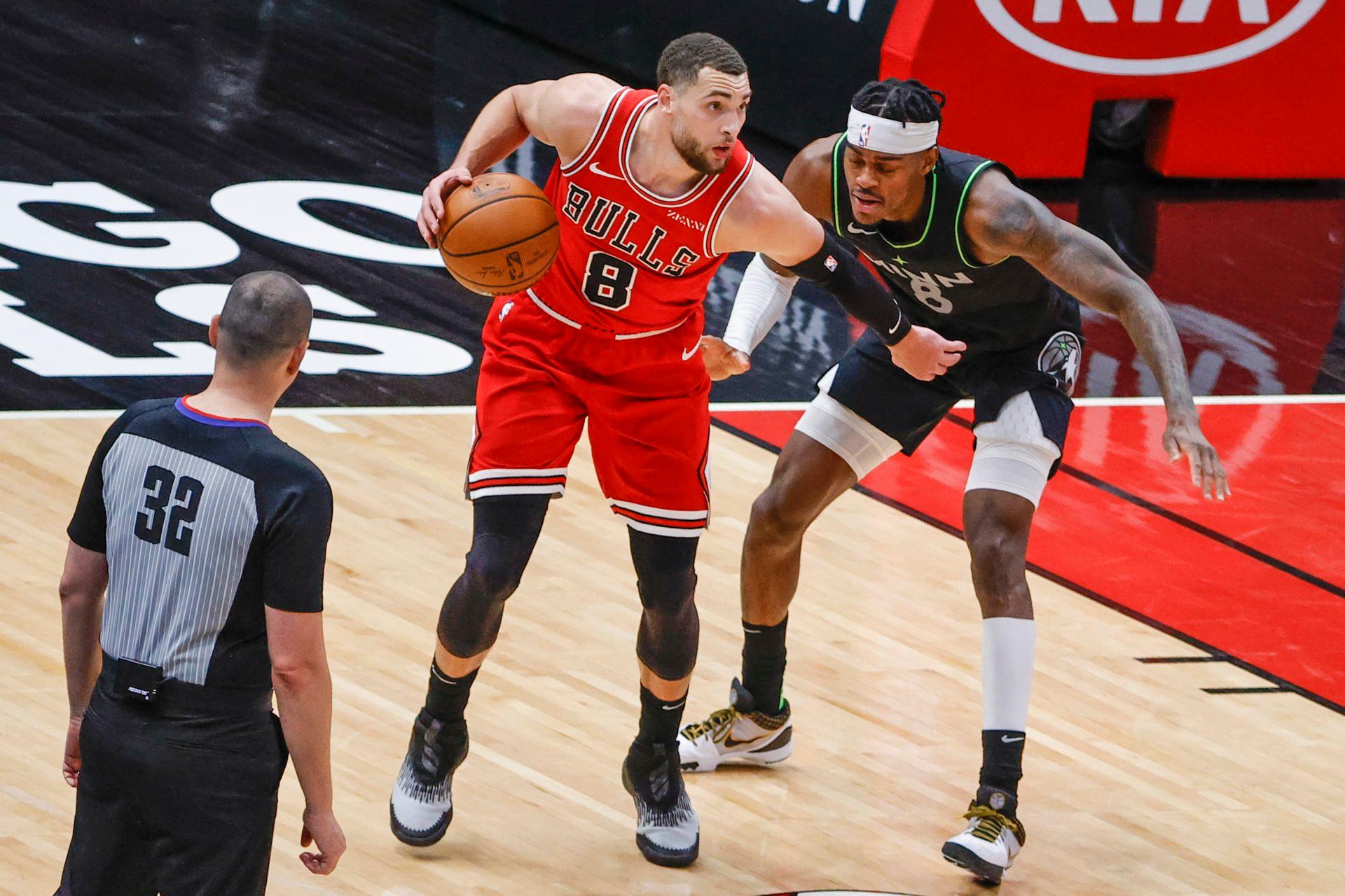 Feb 24, 2021; Chicago, Illinois, USA; Chicago Bulls guard Zach LaVine (8) is defended by Minnesota Timberwolves forward Jarred Vanderbilt (8) during the second half of an NBA game at United Center. Mandatory Credit: Kamil Krzaczynski-USA TODAY Sports