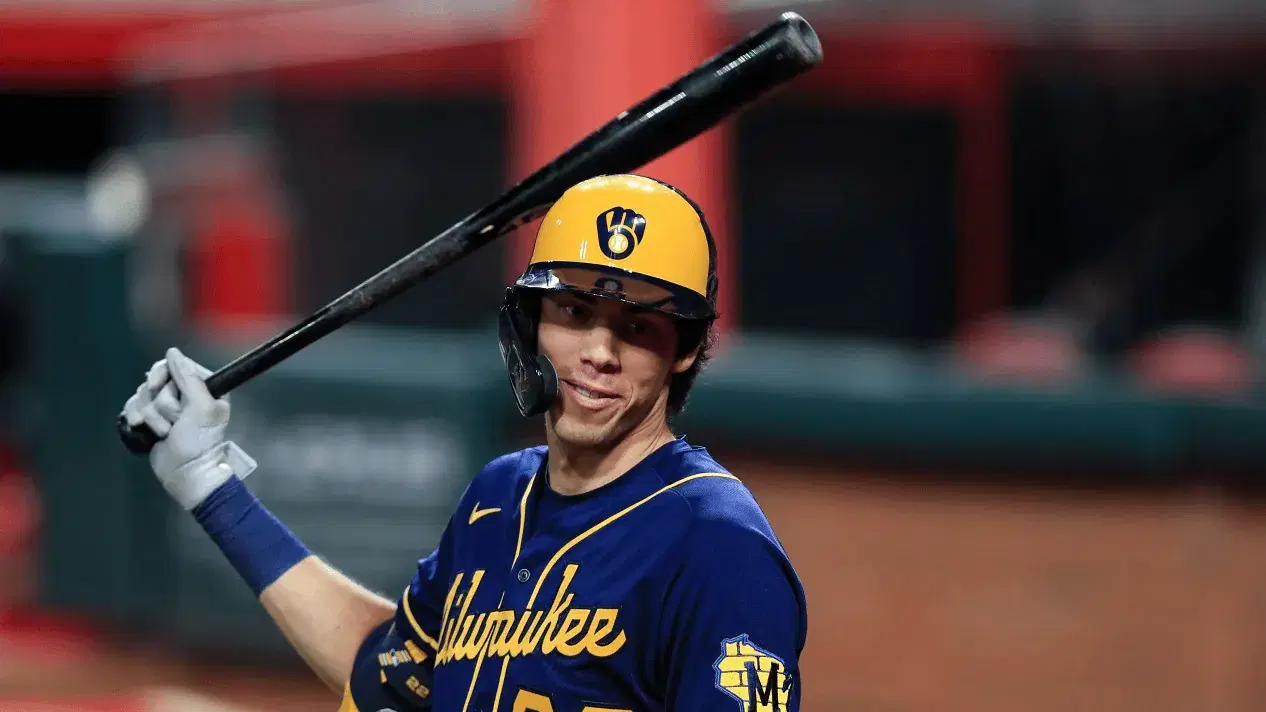 FILE - Milwaukee Brewers' Christian Yelich waits to bat during a baseball game against the Cincinnati Reds in Cincinnati, in this Monday, Sept. 21, 2020, file photo. The average Major League Baseball salary dropped for an unprecedented third straight year, even before the shortened season caused by the novel coronavirus pandemic. Last year’s drop showed the widening imbalance between top stars and other players. The average fell despite Gerrit Cole, Stephen Strasburg, Anthony Rendon and Christian Yelich all starting long-term contracts guaranteeing $215 million or more. (AP Photo/Aaron Doster, File)