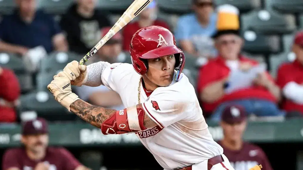 Wehiwa Aloy swings the bat for the Arkansas Razorbacks, the favorite to win the 2025 NCAA Division I baseball tournament