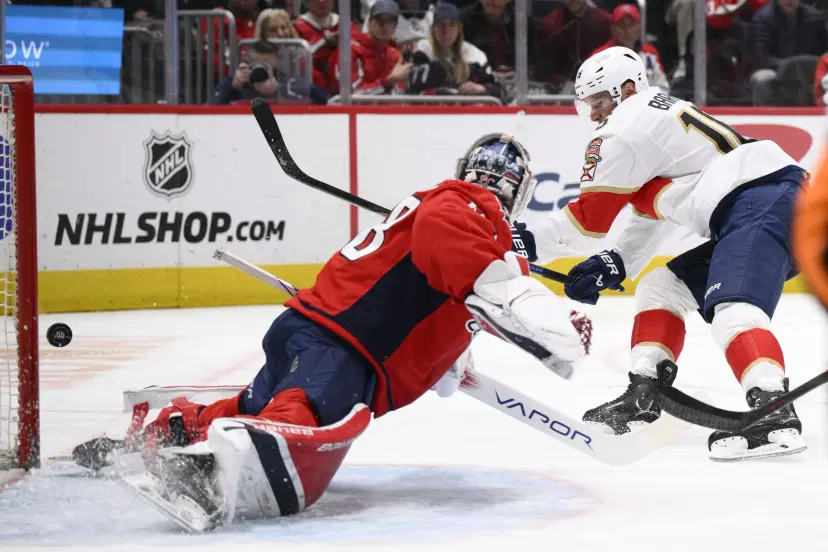 Aleksander Barkov and Logan Thompson