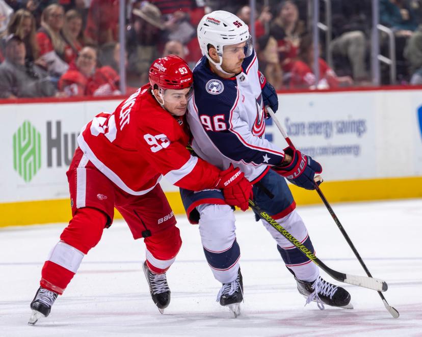 Alex DeBrincat and Columbus defender