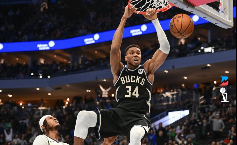 Giannis dunks the ball. 