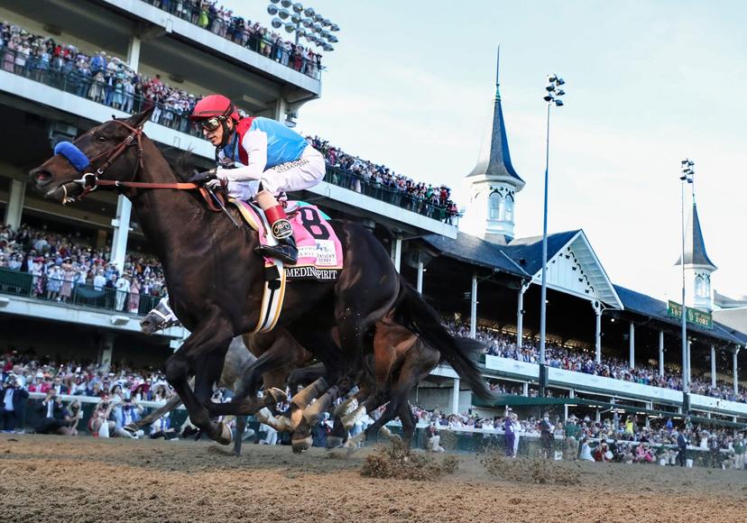The late Medina Spirit crosses the wire just ahead of Mandaloun in 2021